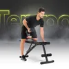 A man is performing a dumbbell row exercise on a black adjustable weight bench. The background is dark with glowing yellow text and smoke effects. Náhľad obrázku produktu