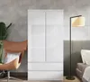 A bedroom or living room setting with a wardrobe, chair, plant, and lamp. Produktbild-Vorschau