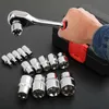 A hand holding a ratchet wrench with a socket attached, surrounded by other sockets, with a black case in the background. Anteprima dell’immagine prodotto
