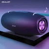 A dark blue portable speaker with purple lighting, placed on a black frame against a gradient background of purple and blue. Produktbild-Vorschau