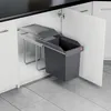 A built-in trash can system inside a kitchen cabinet. Voir les images du produit