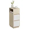 A narrow side table with two white drawers and an open compartment, decorated with a vase of white flowers and a cup of coffee. Náhled obrázku produktu