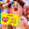 A close-up of a person holding a card in front of a toy character. Podgląd zdjęcia produktu