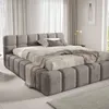 A modern upholstered bed in a bedroom setting. Náhled obrázku produktu