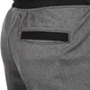 A close-up view of the back pocket of gray sweatpants. Produktbild-Vorschau