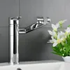 A chrome faucet is shown in a bathroom setting, with a sink and a bouquet of white flowers. Podgląd zdjęcia produktu