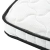 A close-up view of the edge of a white mattress with black trim. Podgląd zdjęcia produktu