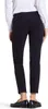 A person wearing black pants and a white shirt, viewed from the back. Anteprima dell’immagine prodotto