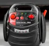 A close-up studio shot of a black and red jump starter device. Podgląd zdjęcia produktu