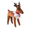 A plush toy reindeer with a red collar and a golden bell. Produktbild-Vorschau