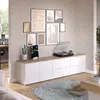 A living room scene with a media console, record player, and artwork on the wall. Náhled obrázku produktu