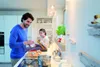 A father and daughter are in a modern kitchen, preparing food. Voir les images du produit