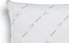 A close-up view of a white pillow with a quilted pattern and green bamboo leaf and text motifs. Produktbild-Vorschau