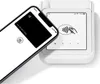 A smartphone is being held over a card reader, demonstrating a contactless payment. Produktbild-Vorschau