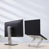 A laptop stand and a monitor stand are shown on a desk. Náhled obrázku produktu