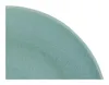A close-up view of the textured surface and curved edge of a teal-colored plate. Náhľad obrázku produktu