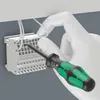 A hand wearing a white glove is using a screwdriver to connect wires to a terminal block. Produktbild-Vorschau