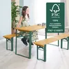 A young girl sits at a wooden picnic table with benches, in what appears to be an indoor setting with a large plant. Podgląd zdjęcia produktu