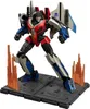 A robot toy standing on a display base with flame effects. Náhled obrázku produktu