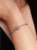A close-up shot of a person's arm wearing a silver Pandora bracelet with a snowflake charm. Produktbild-Vorschau