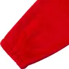 A close-up view of the elasticated cuff of a red garment. Produktbild-Vorschau