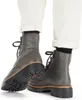 A close-up shot of a person wearing gray Rieker boots and white pants. Produktbild-Vorschau