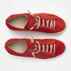A top-down view of two red shoes on a white background. Náhľad obrázku produktu