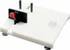A white cutting board with various features for assisted use. Produktbild-Vorschau