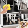 A split image showing a dog transport box. The top part shows a hand cleaning the inside of the box, with a text overlay indicating it's easy to clean. The bottom part shows dogs inside the box, with a text overlay indicating it's paw-friendly. Produktbild-Vorschau