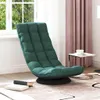 A dark green swivel floor chair is placed next to a window with pink curtains and a small side table with a cup on it. Produktbild-Vorschau