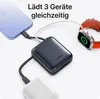 A power bank is shown charging a smartphone, a smartwatch, and a pair of wireless earbuds simultaneously. Produktbild-Vorschau