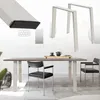 A product image showing table legs and a table with chairs in a room. Náhled obrázku produktu