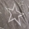 A close-up view of a fabric with a star pattern. Produktbild-Vorschau