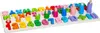 A wooden puzzle board with colorful alphabet letters and numbers, some with stacking rings. Náhled obrázku produktu
