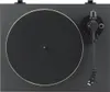 A top-down view of a black turntable with a gold rim around the platter and a black tonearm. Voir les images du produit
