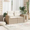 A beige poly rattan sofa with cushions is placed on a patio with a rug and plants. Produktbild-Vorschau