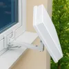 A white satellite dish mounted on a window bracket outside a window. Produktbild-Vorschau