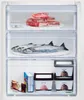 The image shows the inside of a refrigerator with food items stored in drawers. Anteprima dell’immagine prodotto