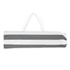 A folded beach chair with gray and white stripes, with white handles, on a white background. Produktbild-Vorschau