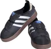 A pair of black Adidas Puffylette sneakers with white stripes and brown soles, presented on a white background. Podgląd zdjęcia produktu