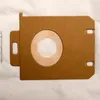 A close-up view of a vacuum cleaner bag with a circular opening and a filter. Produktbild-Vorschau