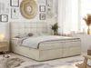 A bedroom scene with a beige box spring bed as the main focus, decorated with wall art and plants. Produktbild-Vorschau