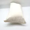 A cream-colored pillow with a zipper on a white background. Produktbild-Vorschau