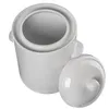 A white ceramic pot with its lid slightly ajar, viewed from directly above. Podgląd zdjęcia produktu