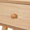 A close-up view of a wooden drawer knob on a wooden drawer. Náhled obrázku produktu