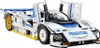 A white and blue Lego Technic model of a Mazda 787B race car with gold wheels. Produktbild-Vorschau