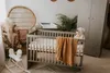 A nursery room with a crib, changing table, wardrobe, and rocking horse. Náhled obrázku produktu
