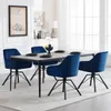 A dining set with four blue velvet chairs around a gray table in a well-lit room. Produktbild-Vorschau