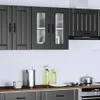A modern kitchen with dark gray cabinets and appliances. Voir les images du produit