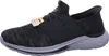 A side view of a black and gray Skechers sneaker. Anteprima dell’immagine prodotto